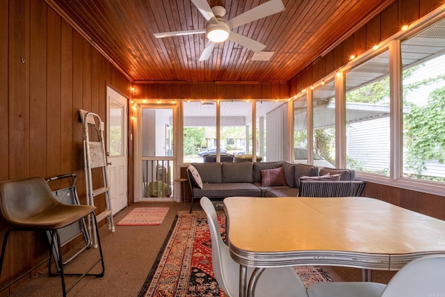 375 Goshen Ave, North Little Rock, AR 72116 - carpeted living area featuring wood ceiling, a ceiling fan, and wood walls