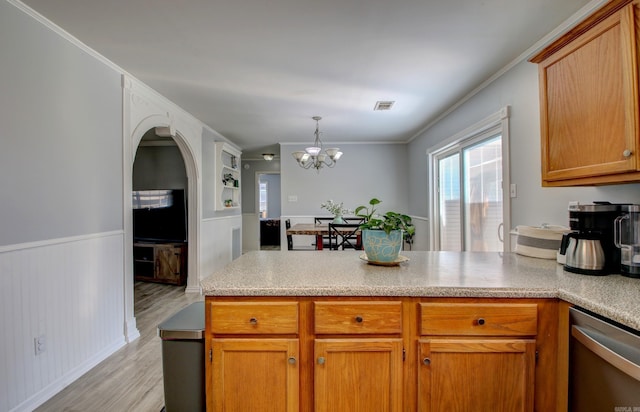 kitchen featuring stainless steel dishwasher, a peninsula, light wood-style flooring, a chandelier, and crown molding