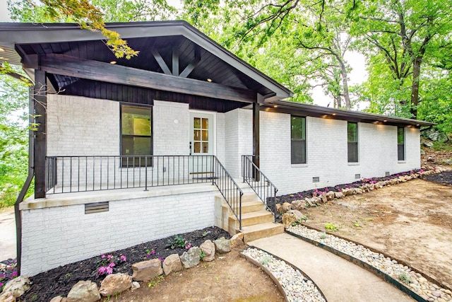 9008 Leatrice Dr, Little Rock, AR 72227 - mid-century home featuring a porch, crawl space, and brick siding