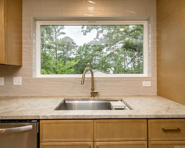 9008 Leatrice Dr, Little Rock, AR 72227 - kitchen featuring a sink, stainless steel dishwasher, backsplash, and plenty of natural light