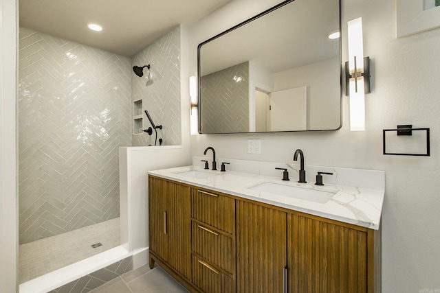 9008 Leatrice Dr, Little Rock, AR 72227 - bathroom featuring walk in shower, double vanity, tile patterned floors, and recessed lighting