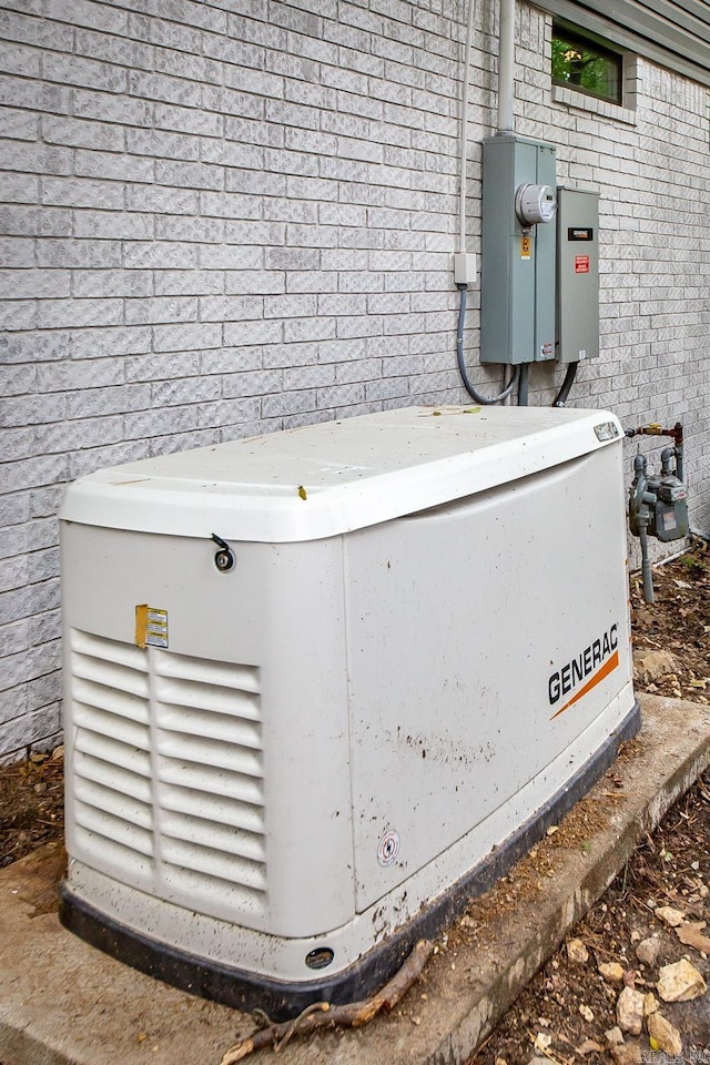 9008 Leatrice Dr, Little Rock, AR 72227 - exterior view of a power unit, electric meter, gas meter, and brick siding