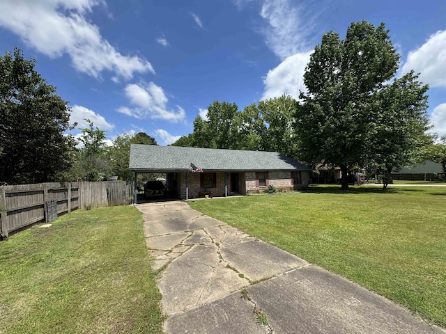 ranch-style house featuring concrete driveway and a carport
