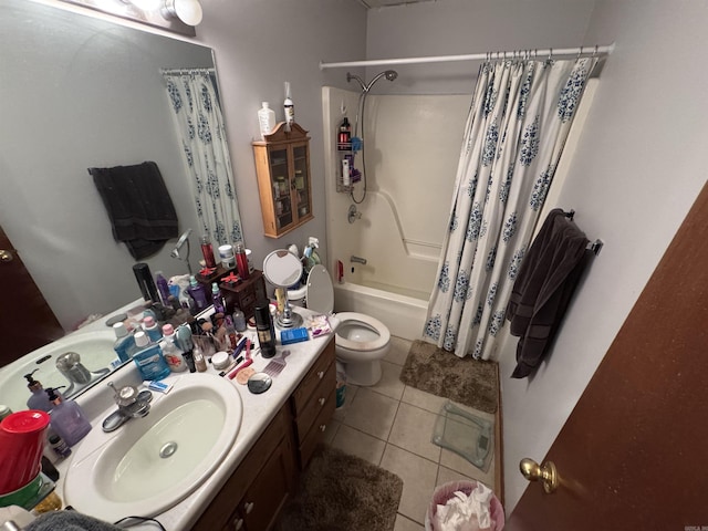 bathroom with vanity, tile patterned floors, shower / tub combo with curtain, and toilet