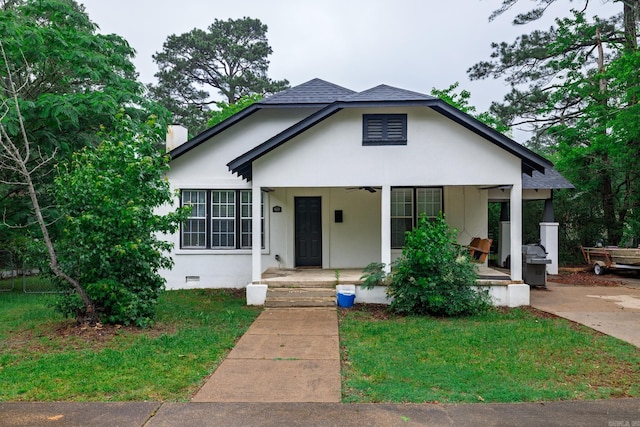 1626 Logan St, Arkadelphia, AR 71923 - bungalow featuring a front lawn, ceiling fan, crawl space, and roof with shingles