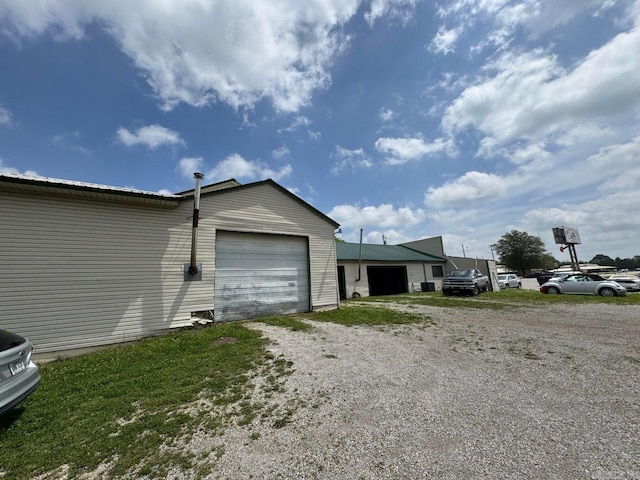 699 Ash Flat Dr, Ash Flat, AR 72513 - view of property exterior featuring dirt driveway and a garage