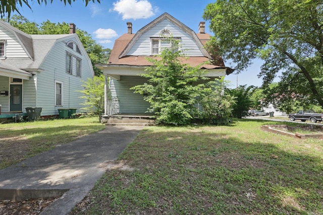 2100 State St, Little Rock, AR 72206 - dutch colonial featuring a gambrel roof, a chimney, and a front lawn
