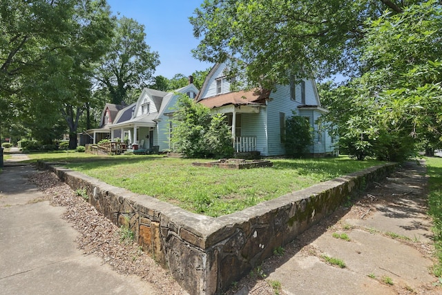 2100 State St, Little Rock, AR 72206 - view of front of house featuring a front lawn and a gambrel roof