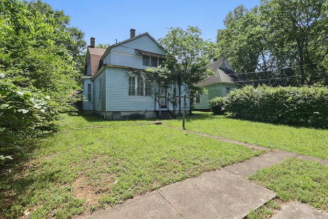 2100 State St, Little Rock, AR 72206 - view of front of property featuring a chimney and a front lawn