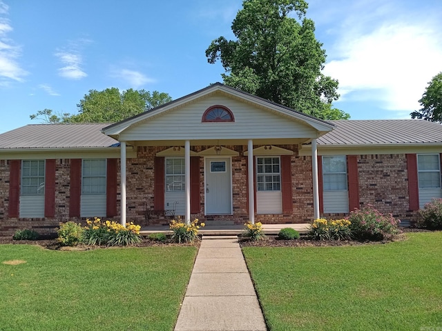 162 Cloverdale, Searcy, AR 72143 - ranch-style house with brick siding, metal roof, and a front lawn