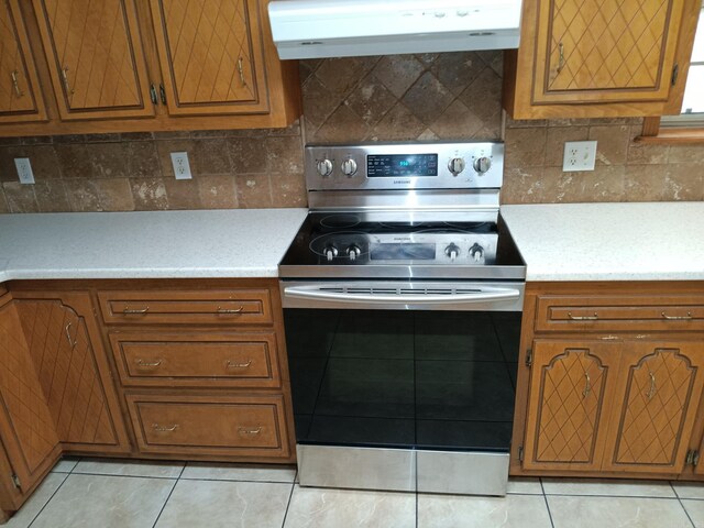 162 Cloverdale, Searcy, AR 72143 - kitchen featuring stainless steel electric range, under cabinet range hood, and brown cabinets