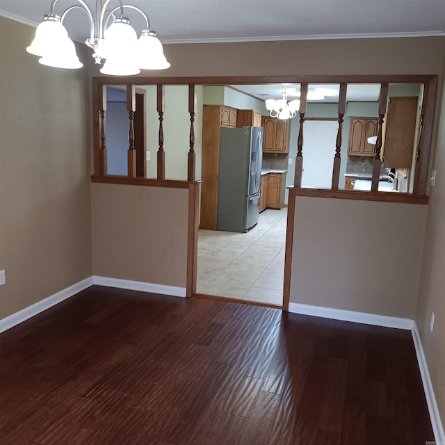 162 Cloverdale, Searcy, AR 72143 - spare room with a chandelier, light wood-type flooring, baseboards, and ornamental molding