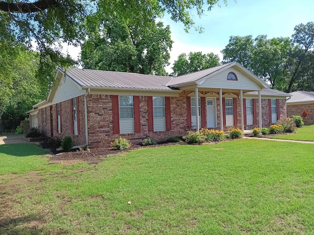 162 Cloverdale, Searcy, AR 72143 - view of front of home with brick siding, a front lawn, an attached garage, and metal roof