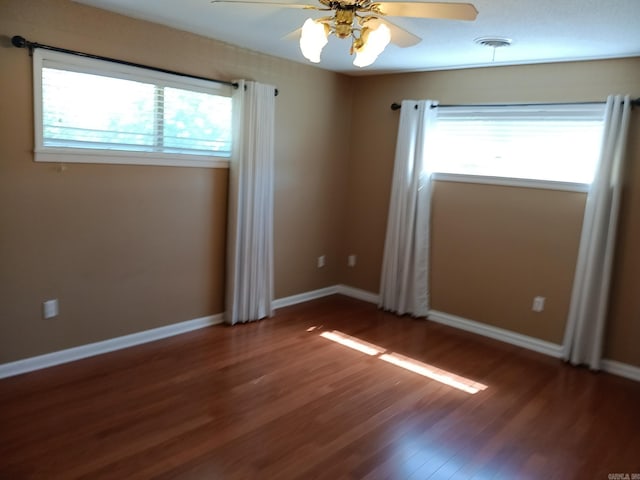 162 Cloverdale, Searcy, AR 72143 - unfurnished room featuring healthy amount of natural light, wood finished floors, a ceiling fan, and baseboards