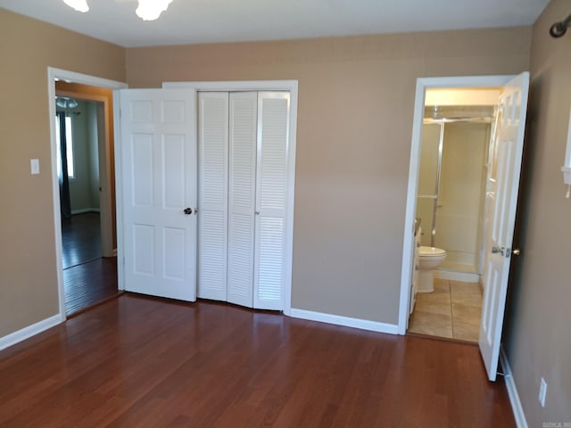 162 Cloverdale, Searcy, AR 72143 - unfurnished bedroom featuring a closet, wood finished floors, baseboards, and ensuite bathroom