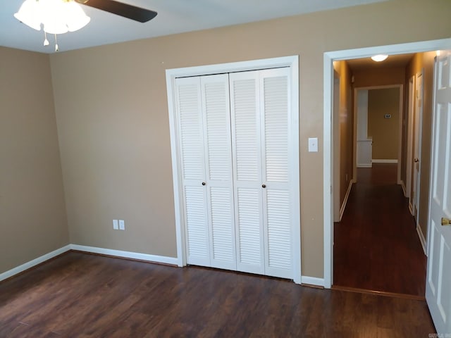 162 Cloverdale, Searcy, AR 72143 - unfurnished bedroom with dark wood-style flooring, a closet, baseboards, and a ceiling fan