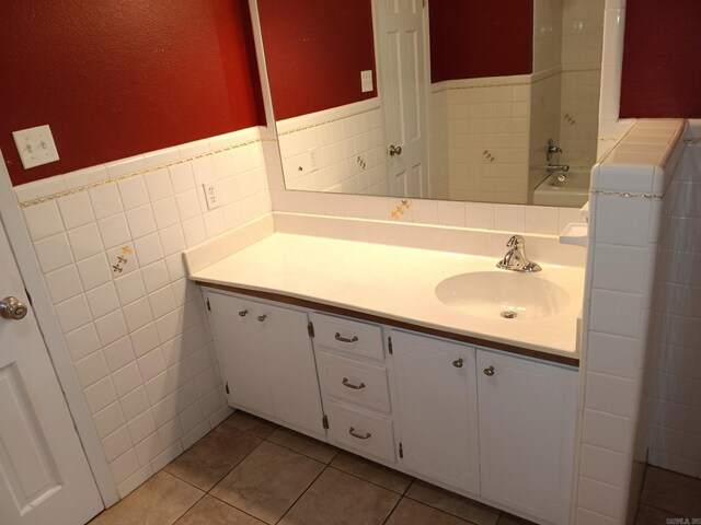162 Cloverdale, Searcy, AR 72143 - full bath with vanity, tile walls, tile patterned floors, a wainscoted wall, and a bath