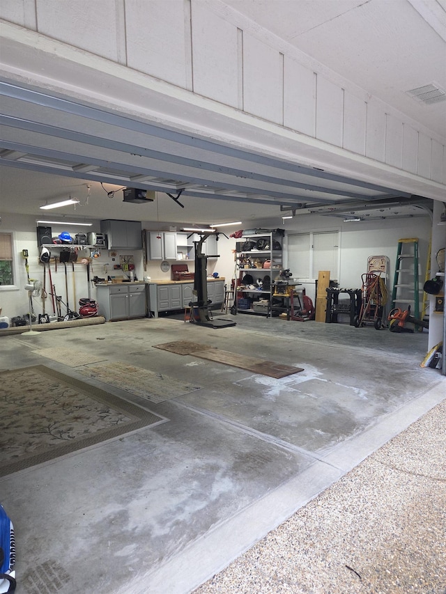 76 Justa Via Way, Hot Springs Village, AR 71909 - garage featuring a garage door opener