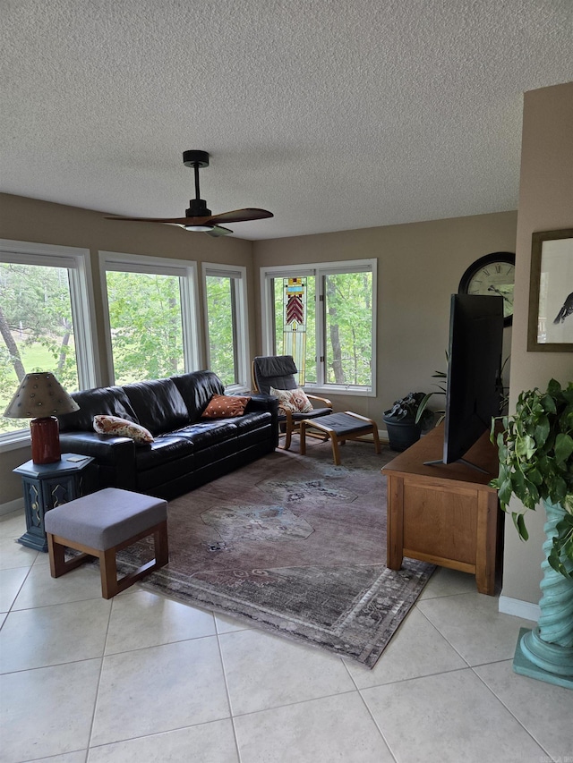 76 Justa Via Way, Hot Springs Village, AR 71909 - living area with a textured ceiling, light tile patterned floors, a ceiling fan, and baseboards