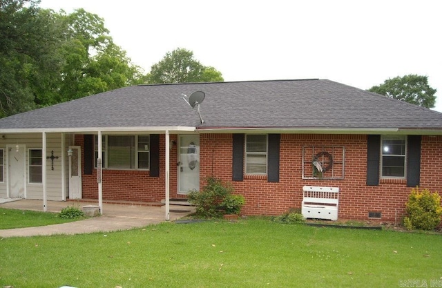 526 N 5th St, Hampton, AR 71744 - view of front of property featuring a front lawn, brick siding, roof with shingles, crawl space, and a porch