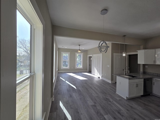 1017 Jefferson, Little Rock, AR 72204 - kitchen featuring a sink, dishwasher, a peninsula, and white cabinetry