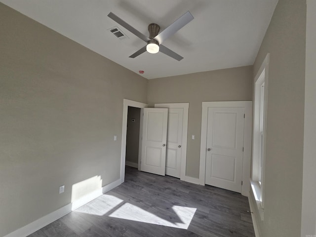 1017 Jefferson, Little Rock, AR 72204 - unfurnished bedroom with baseboards, wood finished floors, and ceiling fan