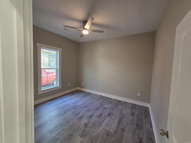 1017 Jefferson, Little Rock, AR 72204 - unfurnished room with dark wood-type flooring, ceiling fan, and baseboards