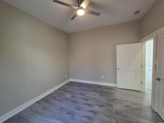 1017 Jefferson, Little Rock, AR 72204 - unfurnished room featuring ceiling fan, baseboards, and dark wood-type flooring