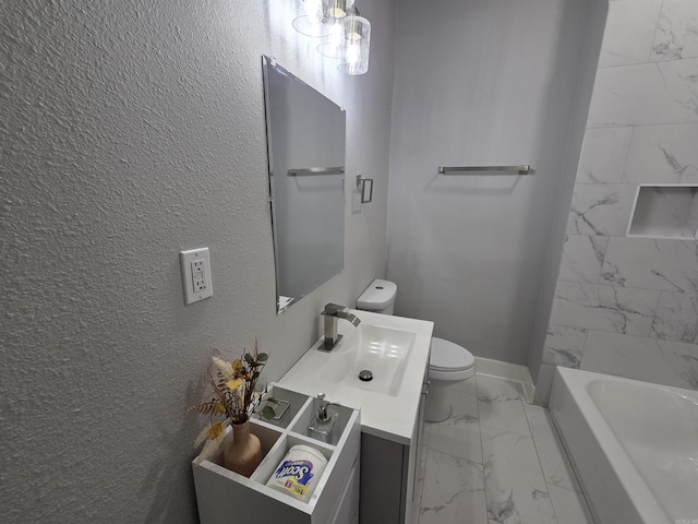1017 Jefferson, Little Rock, AR 72204 - bathroom featuring marble look tiles, toilet, vanity, and baseboards
