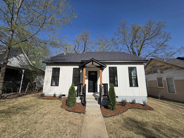 1017 Jefferson, Little Rock, AR 72204 - view of front of house with crawl space, board and batten siding, and a shingled roof