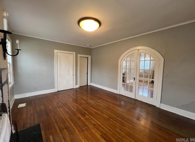 3224 W 11th St, Little Rock, AR 72204 - unfurnished bedroom featuring wood finished floors, ornamental molding, baseboards, arched walkways, and french doors
