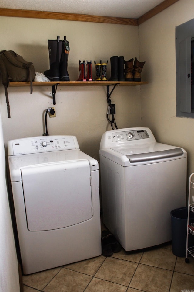 100 Elizabeth St, Prescott, AR 71857 - clothes washing area with washer and dryer, electric panel, and light tile patterned floors