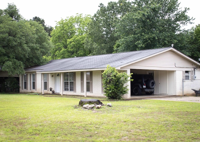 100 Elizabeth St, Prescott, AR 71857 - single story home with driveway, an attached carport, brick siding, a front yard, and board and batten siding