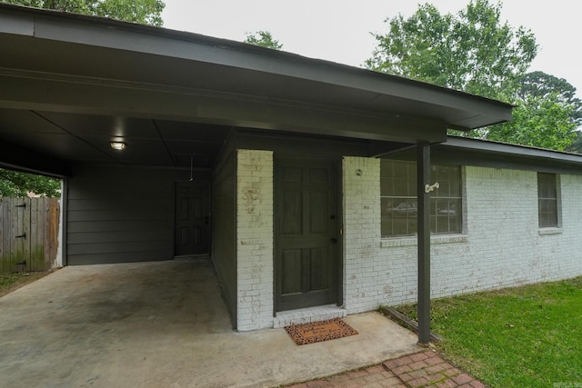 3516 Vickie Dr, Bryant, AR 72022 - entrance to property featuring fence, brick siding, and an attached carport