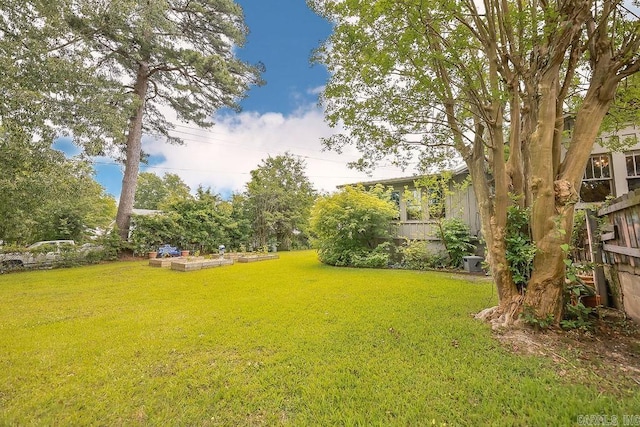 608 E 5th St, El Dorado, AR 71730 - view of yard featuring a vegetable garden