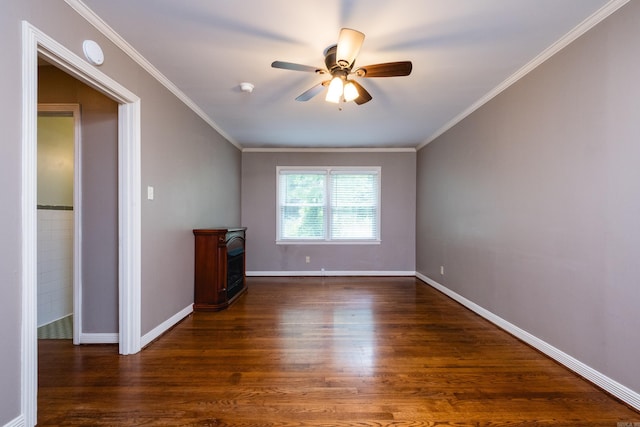15 Coolwood Dr, Little Rock, AR 72202 - empty room with wood finished floors, ceiling fan, crown molding, baseboards, and a fireplace