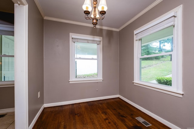15 Coolwood Dr, Little Rock, AR 72202 - empty room featuring a chandelier, baseboards, dark wood-type flooring, healthy amount of natural light, and crown molding