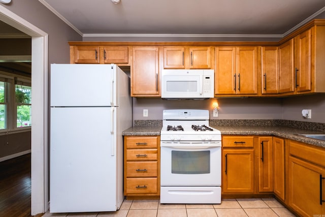 15 Coolwood Dr, Little Rock, AR 72202 - kitchen with white appliances, ornamental molding, dark countertops, brown cabinetry, and light tile patterned floors