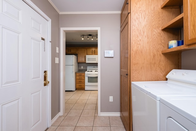 15 Coolwood Dr, Little Rock, AR 72202 - washroom featuring washer and clothes dryer, ornamental molding, light tile patterned flooring, track lighting, and baseboards