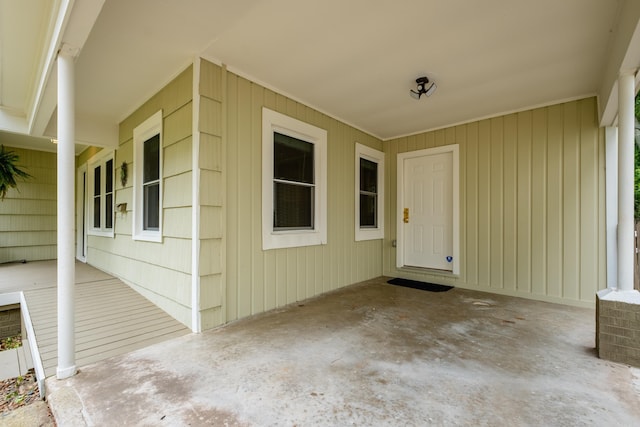 15 Coolwood Dr, Little Rock, AR 72202 - view of exterior entry with a patio area and a carport