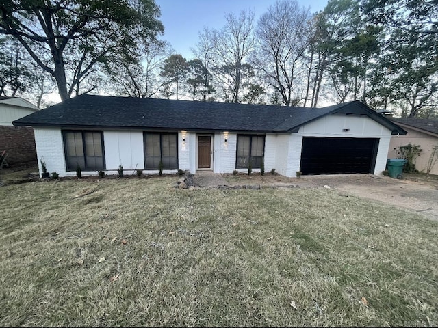 11808 Saint Charles Blvd, Little Rock, AR 72211 - view of front of home with brick siding, driveway, an attached garage, a front yard, and roof with shingles