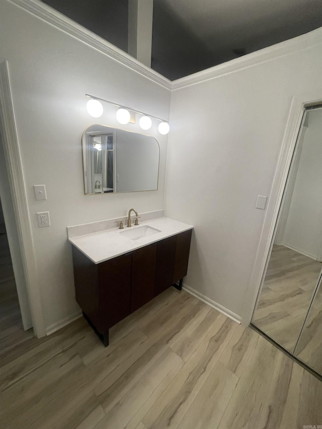 11808 Saint Charles Blvd, Little Rock, AR 72211 - bathroom with wood finished floors, vanity, and baseboards
