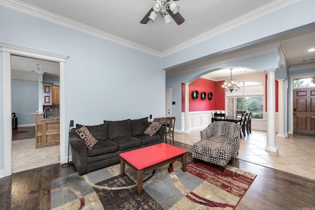 110 Clervaux Cir, Little Rock, AR 72223 - living room featuring decorative columns, arched walkways, ceiling fan, ornamental molding, and a chandelier