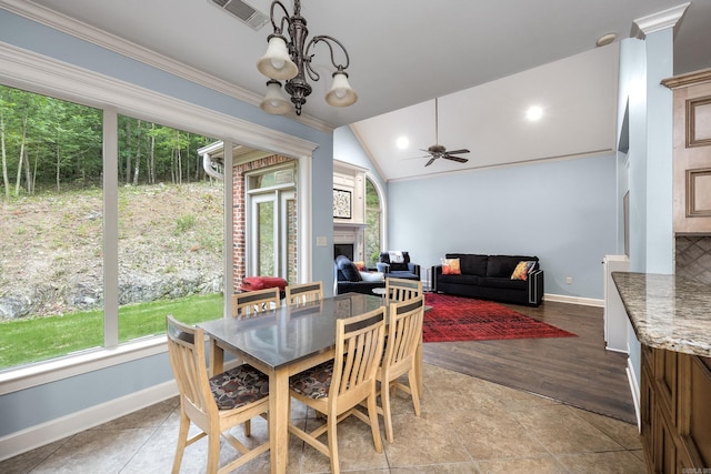 110 Clervaux Cir, Little Rock, AR 72223 - dining space featuring healthy amount of natural light, baseboards, a fireplace, crown molding, and lofted ceiling