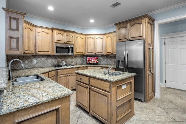 110 Clervaux Cir, Little Rock, AR 72223 - kitchen with stainless steel appliances, a sink, light stone counters, an island with sink, and ornamental molding