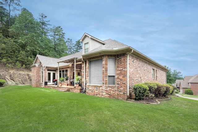 110 Clervaux Cir, Little Rock, AR 72223 - view of front of home featuring brick siding, a front yard, a patio, and roof with shingles