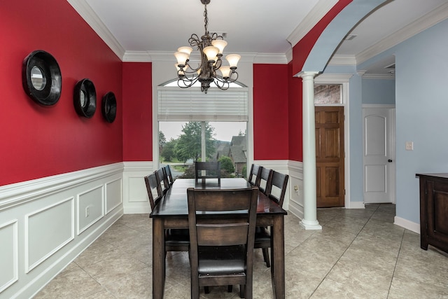 110 Clervaux Cir, Little Rock, AR 72223 - dining space featuring ornate columns, a chandelier, crown molding, a wainscoted wall, and light tile patterned floors