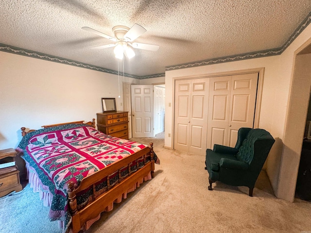 53 White Oak Cir, Searcy, AR 72143 - bedroom with carpet, a closet, a textured ceiling, and a ceiling fan