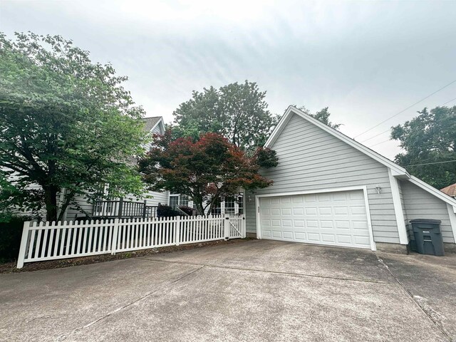 53 White Oak Cir, Searcy, AR 72143 - view of front of home featuring concrete driveway, fence, and a garage