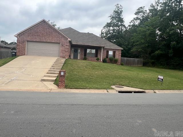 1808 Hidden Crk, Sherwood, AR 72120 - view of front of property featuring an attached garage, driveway, and brick siding